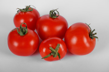 A red tomato bunch on white. Top view