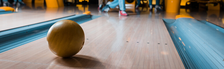 panoramic shot of bowling ball on skittle alley in bowling club - obrazy, fototapety, plakaty