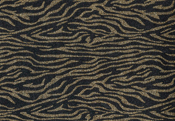 Abstract gold sparkles on a black background. For backgrounds, cards, banners.