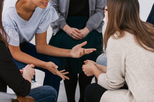 Women with problems sitting together during counseling