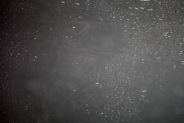 water drops on dark plastic background texture