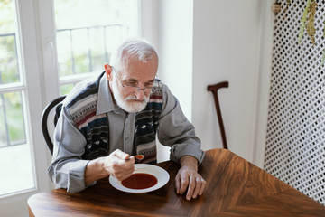 Eating dinner by himself