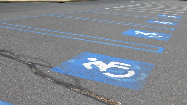 Row of handicap parking spaces outside day