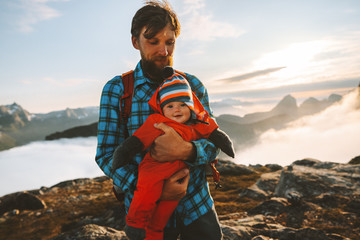 Father traveling with baby in mountains family vacations hiking healthy lifestyle man with child...