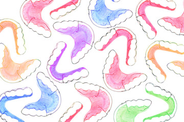 Colorful dental braces or retainers for teeth on background, clipping paths
