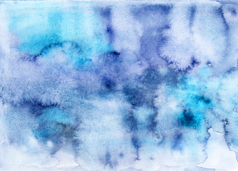 Abstract blue and ultramarine watercolor stains. Hand drawn watercolor trendy textured background. Gradient modern cloudy wallpaper. Blue and violet sky. Horizontal.  Aquarelle.