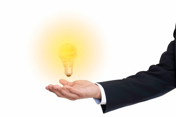 Illuminated bulb in businessman hand  liken his new idea on white background(with clipping path)