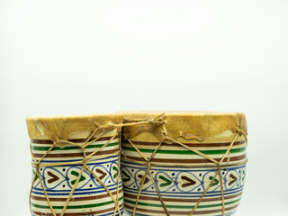 Moroccan drums standing alone on a white background with space at the top of the image for text. Concept musical instrument.