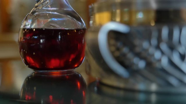 Tilt up to reveal wine and Eucharist in church