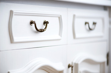 Detail of vintage white cabinet - selective focus, copy space
