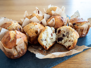 muffins with chocolate chips on black stone plate
