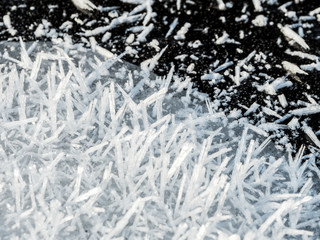 Layer of ice crystals on dark ice surface