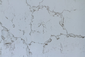 Close up detail pattern of decay textured from dark white coloring on the outdoor old cement wall background.