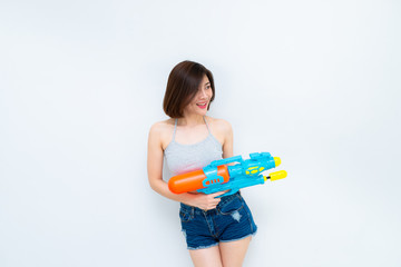 Asian sexy woman with gun water in hand on white background,Festival songkran day at thailand,The best of festival of thai,Land of smile