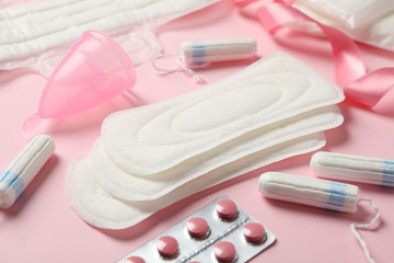 Obraz na płótnie Canvas Menstruation period accessories on pink background, close up