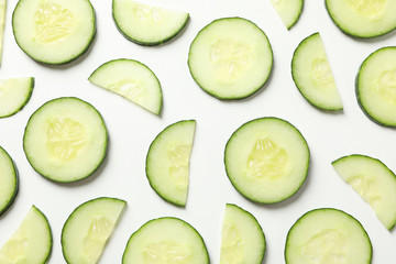Fresh cucumber slices on white background, top view