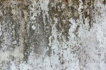 Old concrete wall with paint stains.