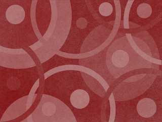 Different pink circles with a light texture on a burgundy background