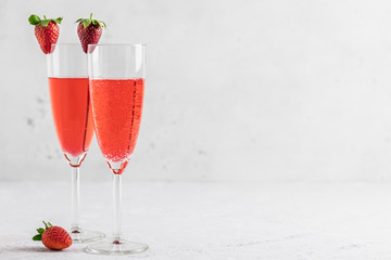 Strawberry party drinks in champagne glasses. Selective focus, copy space.