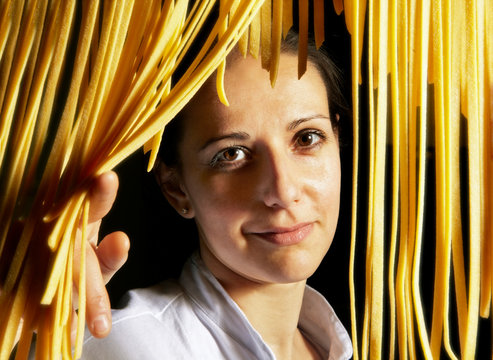 Portrait of a young italian woman, as chef 