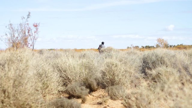 Moroccan Herdsman wandering the desrt of Ain Chouatar