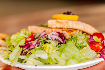 Fresh garden salad. Fresh garden salad on a plate. Fresh and healthy vegetable salad with meat