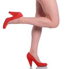 woman legs in shoes on white background