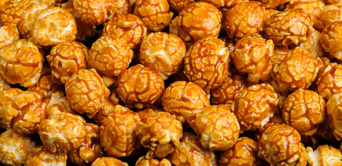 sweet Caramel Cream popcorn on the black background