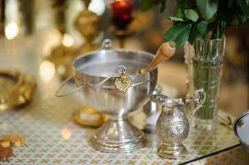Aspergilium in aspersorium - liturgical implement used to sprinkle holy water