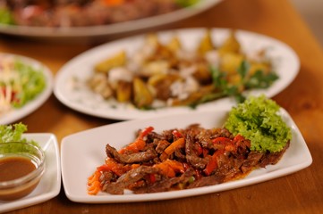 table full of different food. Restaurant party