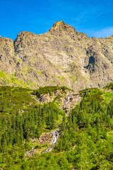 Lower Rysy - Niznie Rysy - and Rysy peaks rising above Czarny Staw pod Rysami, Black Pond below Rysy, in Tatra Mountains in Poland