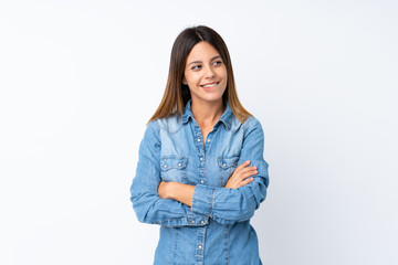 Young woman over isolated white background with confuse face expression
