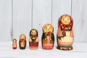 Russian national wooden nesting toys - matryoshka (nested doll) - in form of women in national...