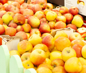 Many apples in boxes are sold in the store