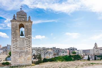 Fototapeta premium Bell tower and historical houses of Gravina di Puglia, Italy