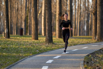 Young woman running in the park