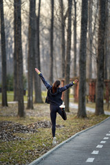 Fototapeta na wymiar Young woman running in the park