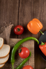 Chilies, tomato and white sliced bread