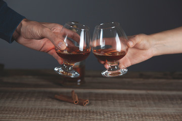 woman and man hand glass of brandy