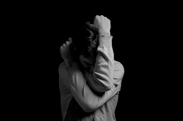 black and white dramatic photo in a depressed pose
