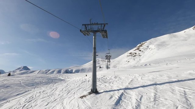 winter sports: timelapse on the chairlift in the ski area, sunny day