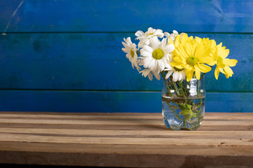 A flower vase in blue background