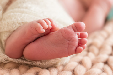 baby newborn foot finger closeup detail  small leg feet