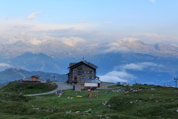 Alpine hut Rifugio Graffer and mountain alps panorama of Adamello-Presanella Alps seen from Brenta...
