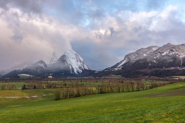 Winter landscape with snow covered Grimming mountain in Ennstal, Steiermark, Austria