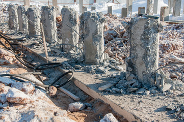 Demolition of concrete piles. Concrete base of the new building.