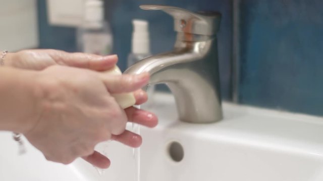 Woman Washing Her Hands. Hygienic procedure.
