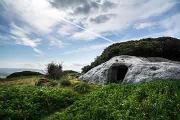 Fototapeta na wymiar Domus de Janas, fairy house, prehistoric stone structure typical of Sardinia