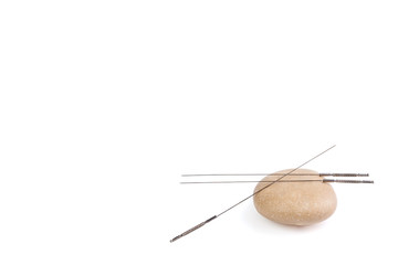 Silver needles for traditional Chinese acupuncture medicine. Isolated white background.