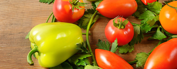 Vegetables on old wooden table. Flat lay, top view. Wide photo.